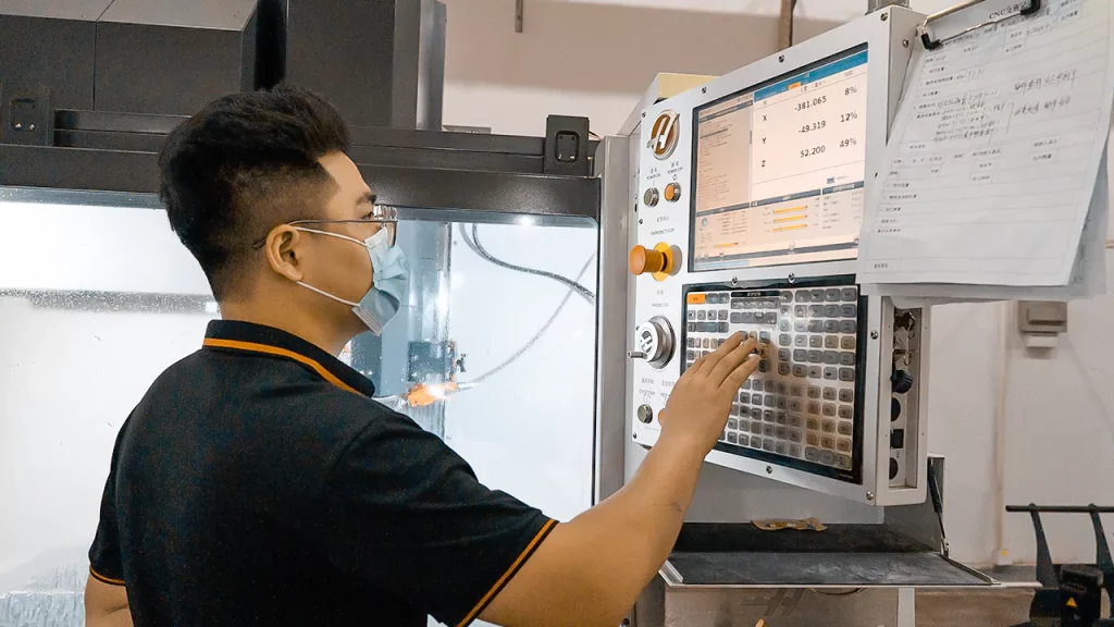 CNC Machinist working on a CNC center