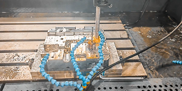 EDM machining method to machine a mold part