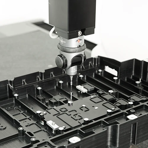 injection molded plastic parts being inspected